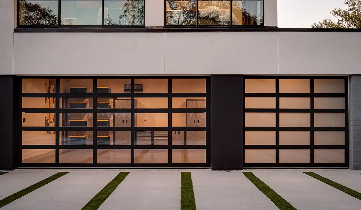 Clopay Avante glass and aluminum garage doors on a modern home